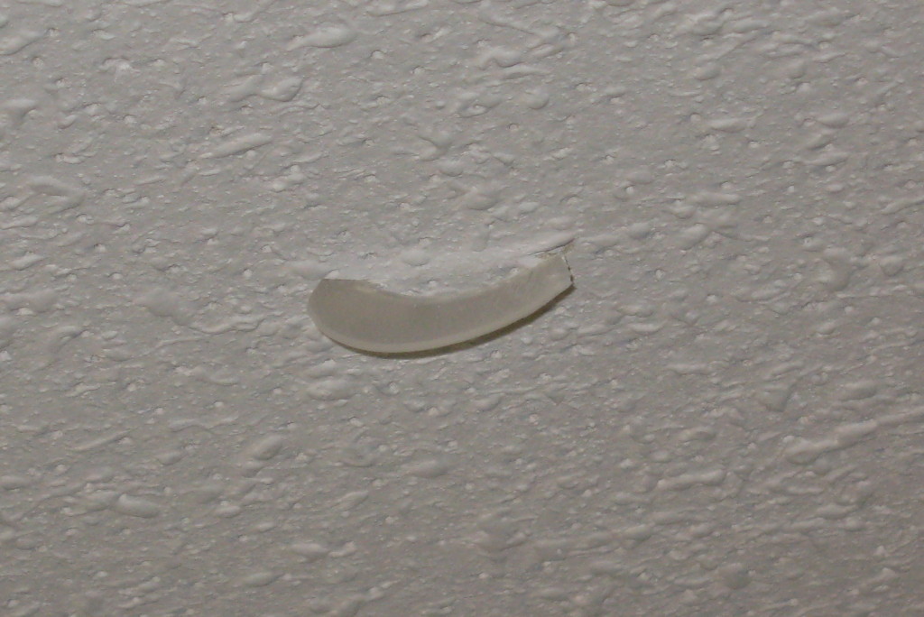 Piece Lodged in Ceiling Tile